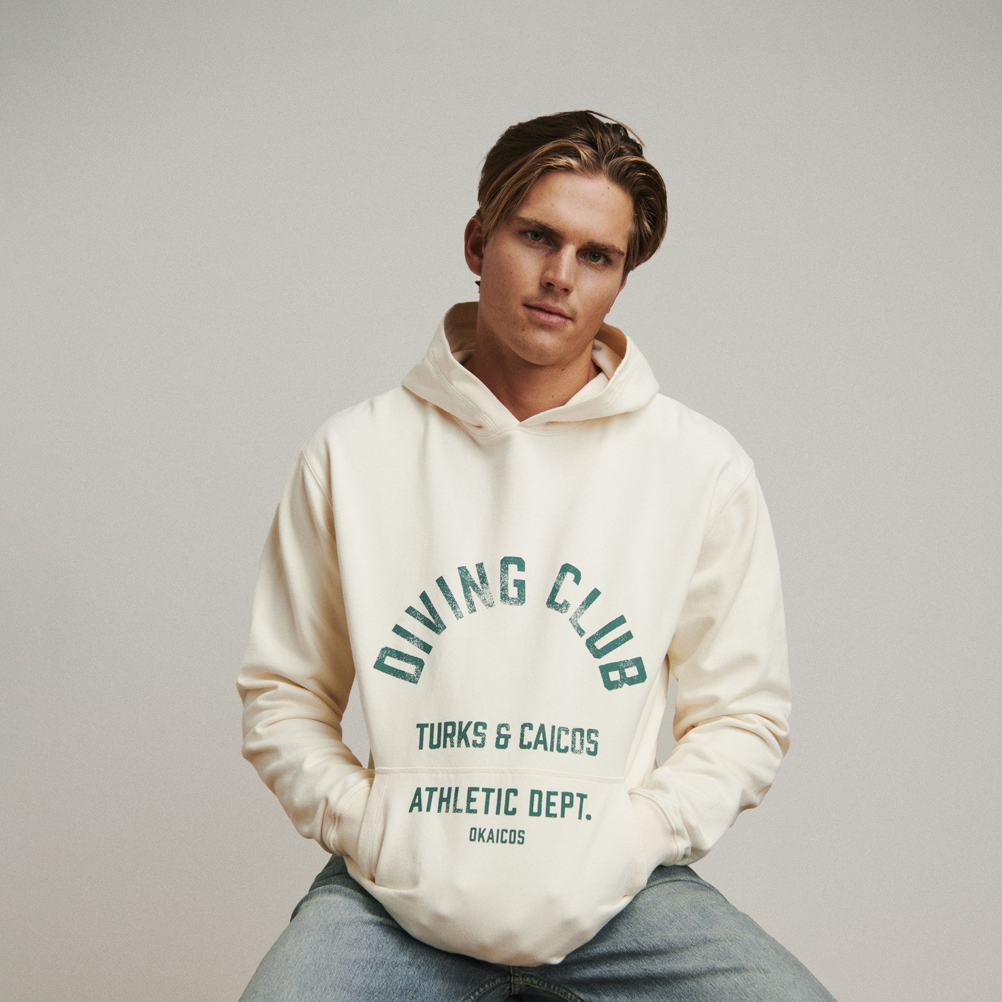 OKAICOS Dive Club Cream Washed Hoodie Turks and Caicos Sitting