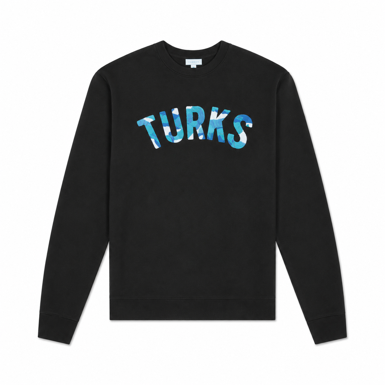 A black crewneck sweatshirt with the word 'TURKS' printed across the chest in a blue and white tie-dye pattern, displayed on a clean white background.