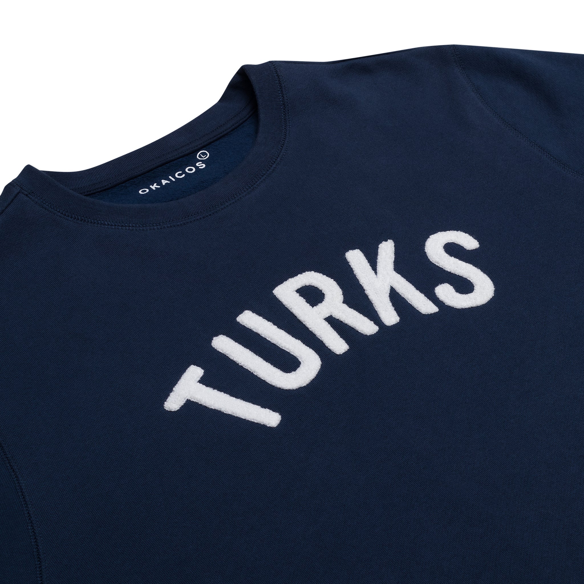 OKAICOS Navy Chenille Embroidered Crewneck Cotton Sweatshirt Embroidered Turks And Caicos Flat Lay Close Up