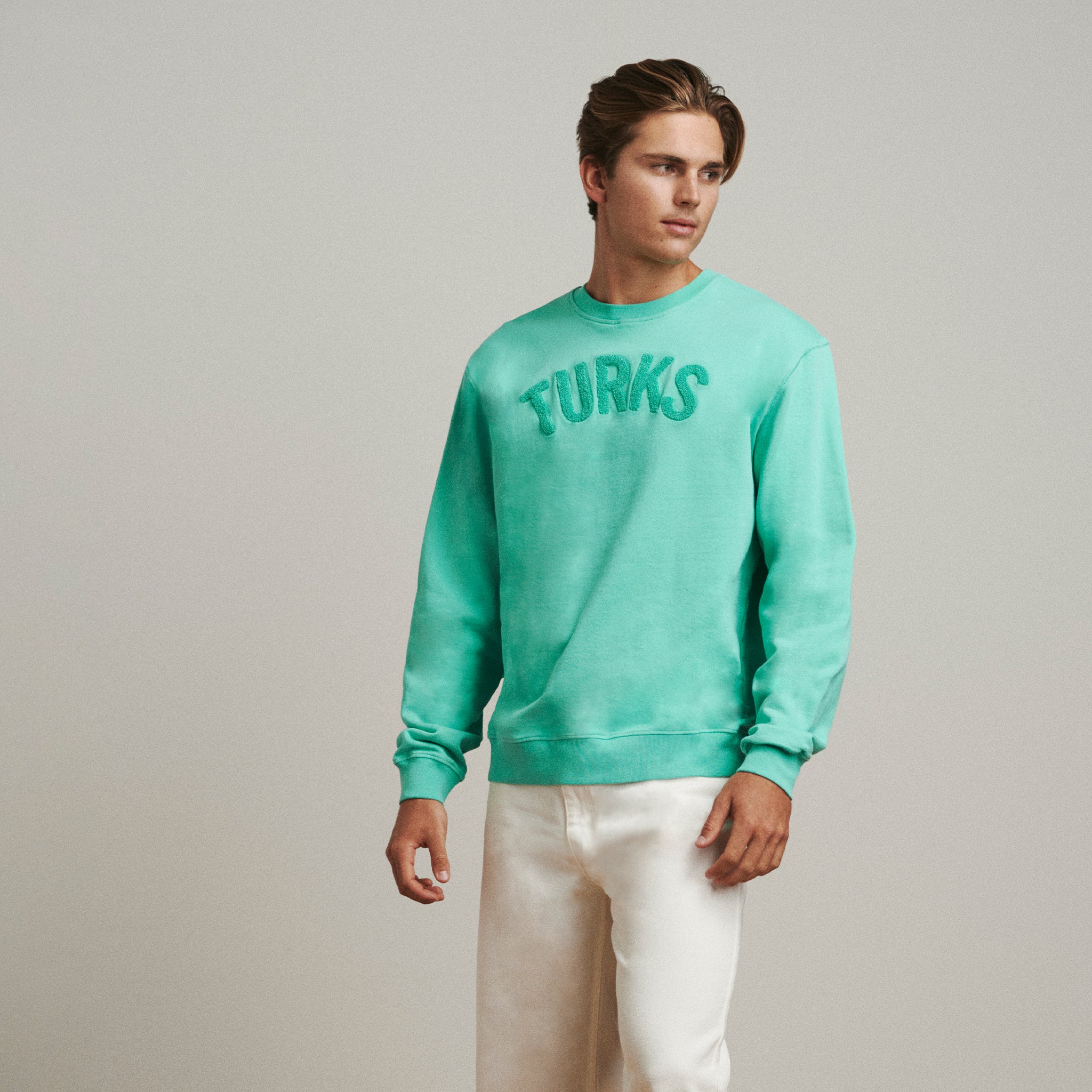 OKAICOS Acqua Teal Turks Chenille Embroidered Crewneck Cotton Sweatshirt Turks And Caicos Front