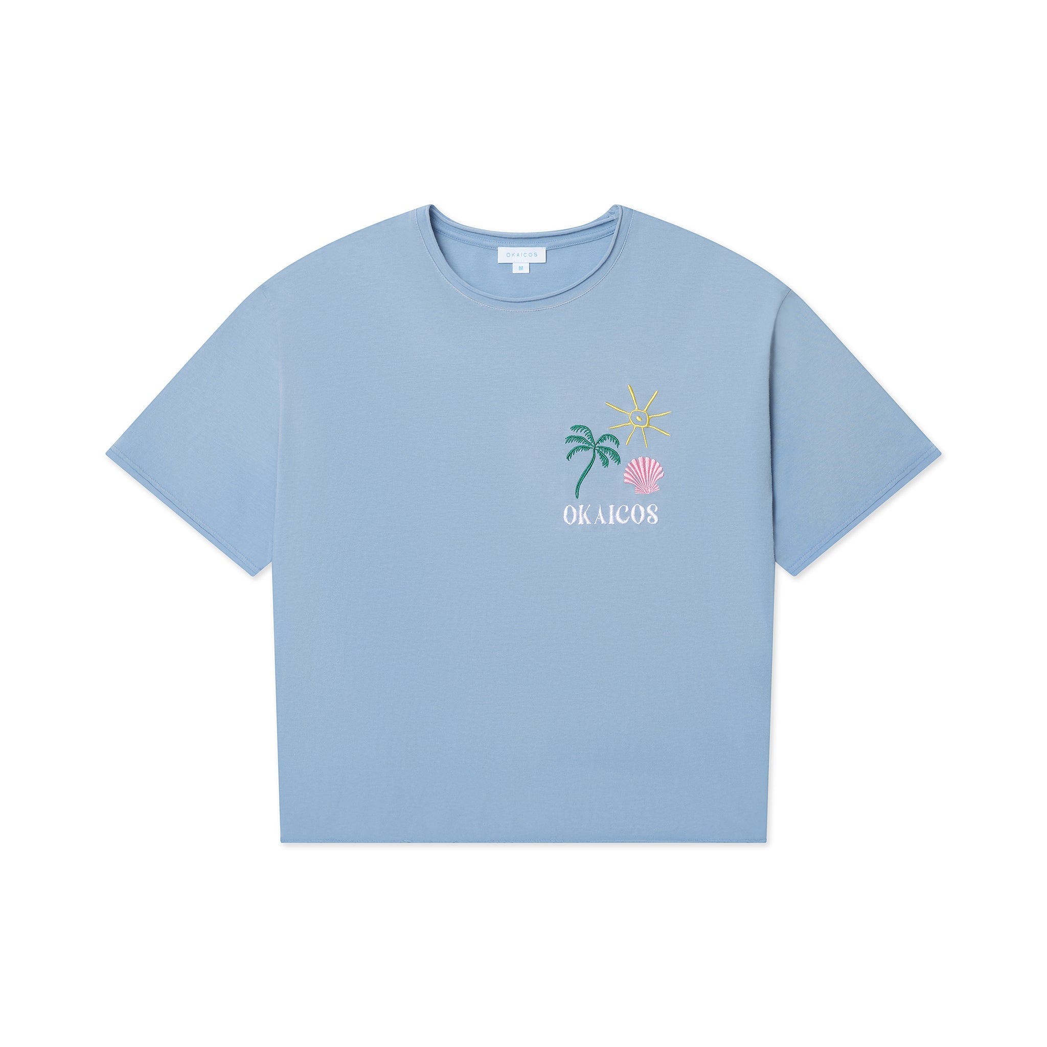 Light blue t-shirt with palm tree and shell design on a white background