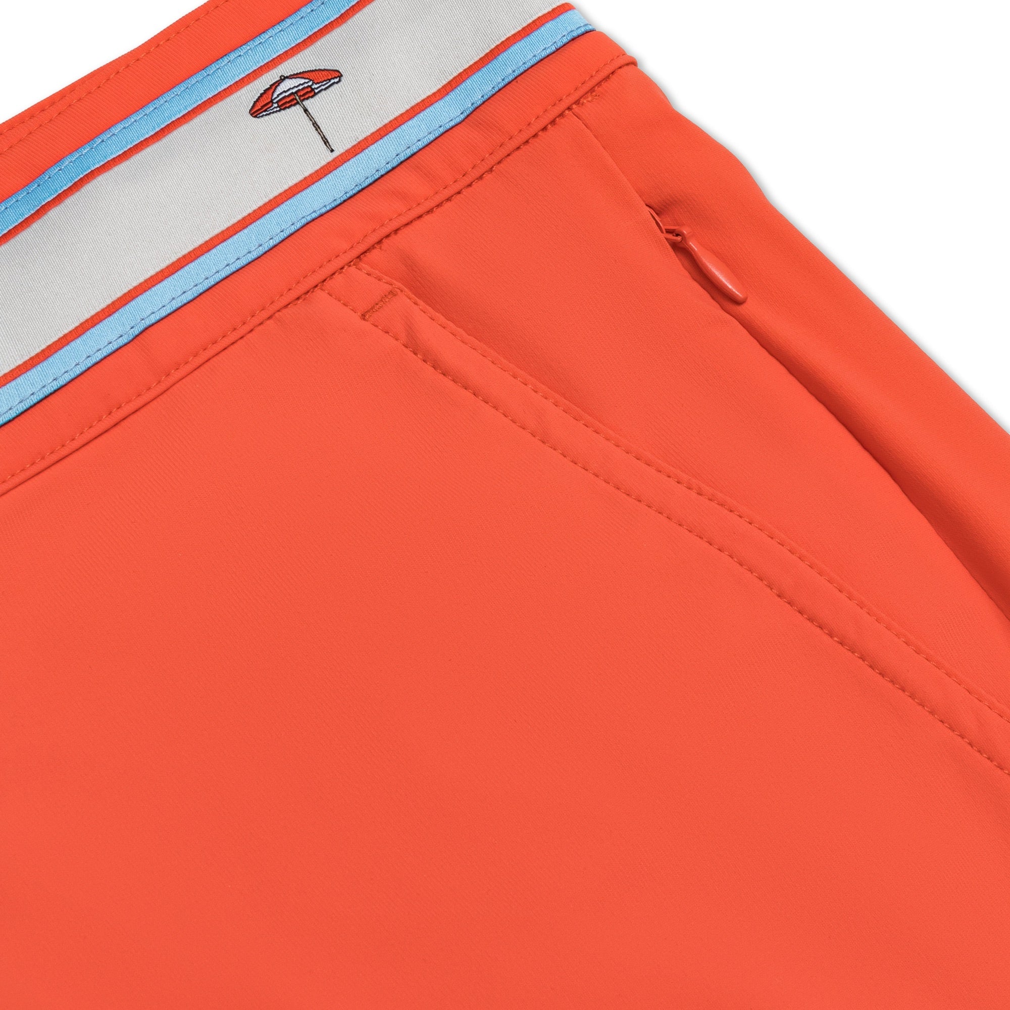 OKAICOS Coral Turks & Caicos Umbrella Athletic Mens Swim Trunk Board Short Flat Lay Close Up