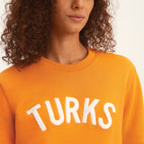 OKAICOS Orange Chenille Embroidered Crewneck Cotton Sweatshirt Embroidered Turks And Caicos Close Up