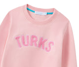 OKAICOS Pink Chenille Embroidered Kids Crewneck Cotton Sweatshirt Embroidered Turks And Caicos Flatlay Close Up