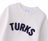 White Chenille Embroidered Kids Crewneck Cotton Sweatshirt Embroidered Turks And Caicos Flatlay Close Up
